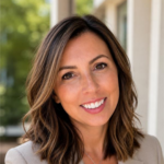 Portrait of a smiling woman with shoulder-length brown hair and subtle highlights, wearing a beige blazer, outdoors in natural light.